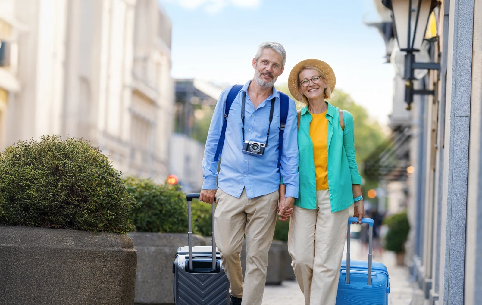 Happy travellers with their luggage