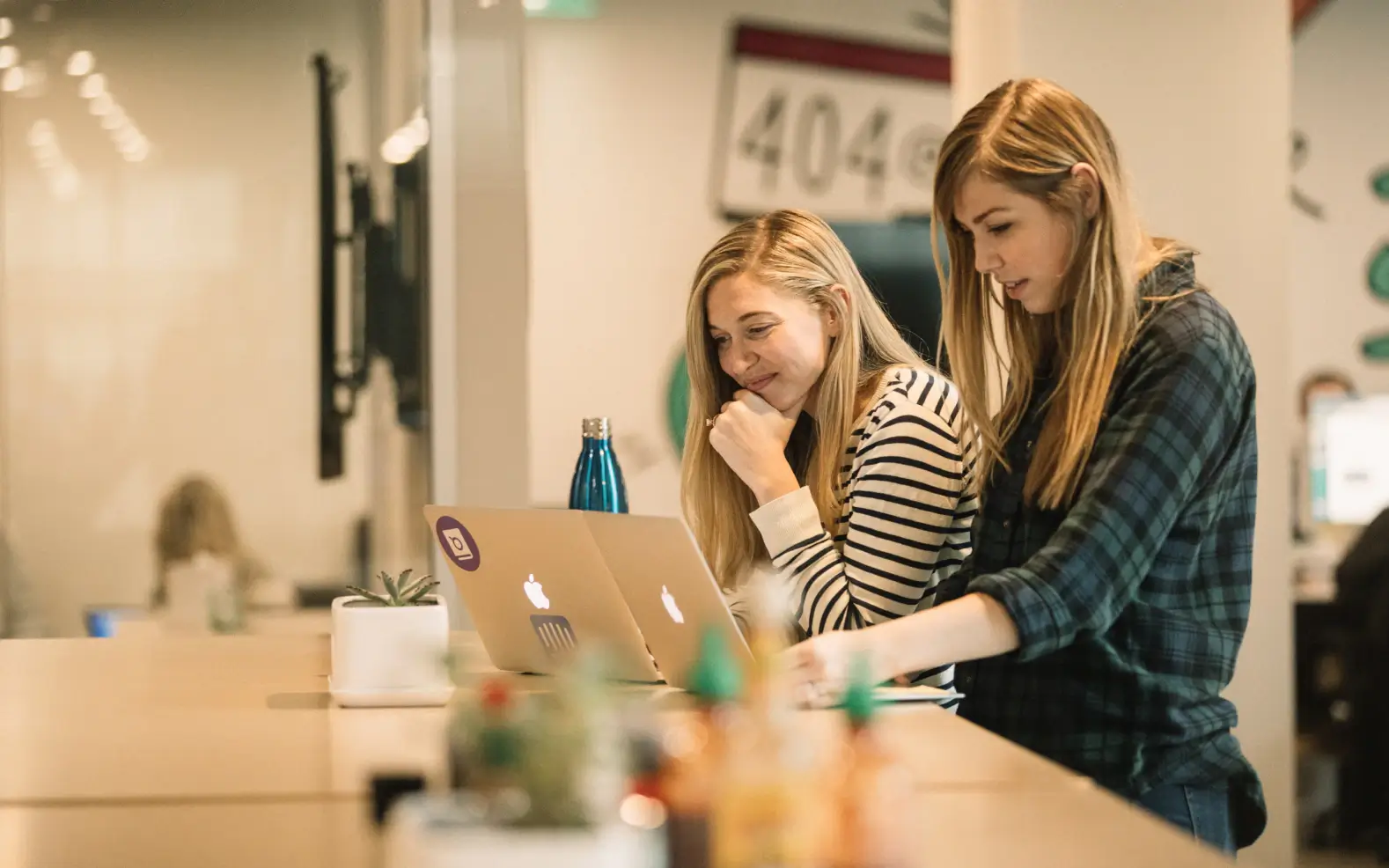 Intercom employees working at a desk in their office