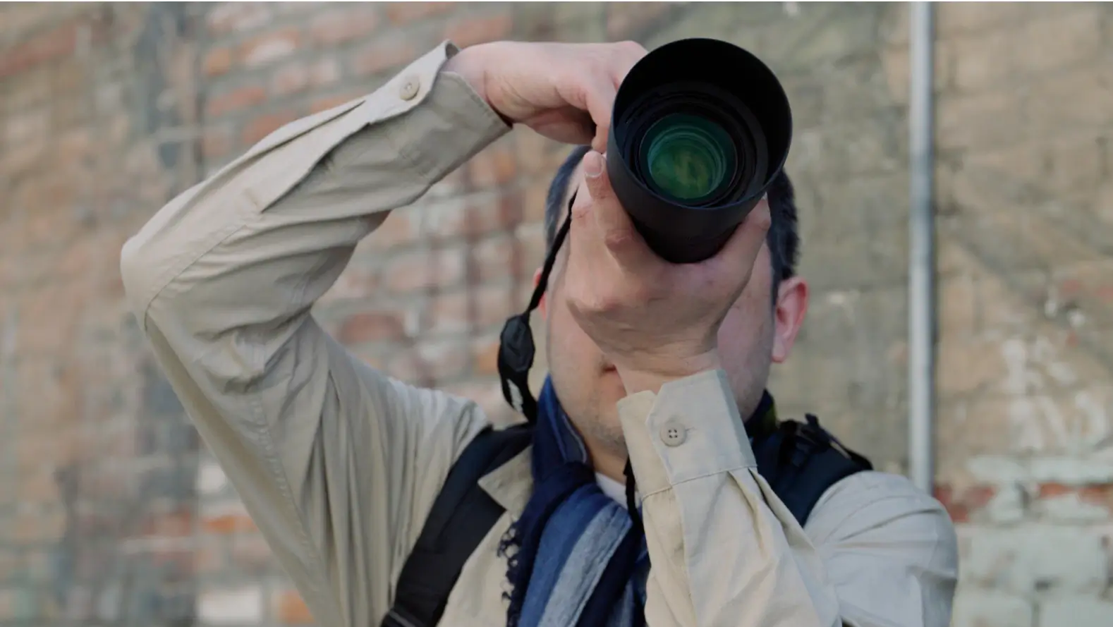 The Associated Press reporter using camera outdoors