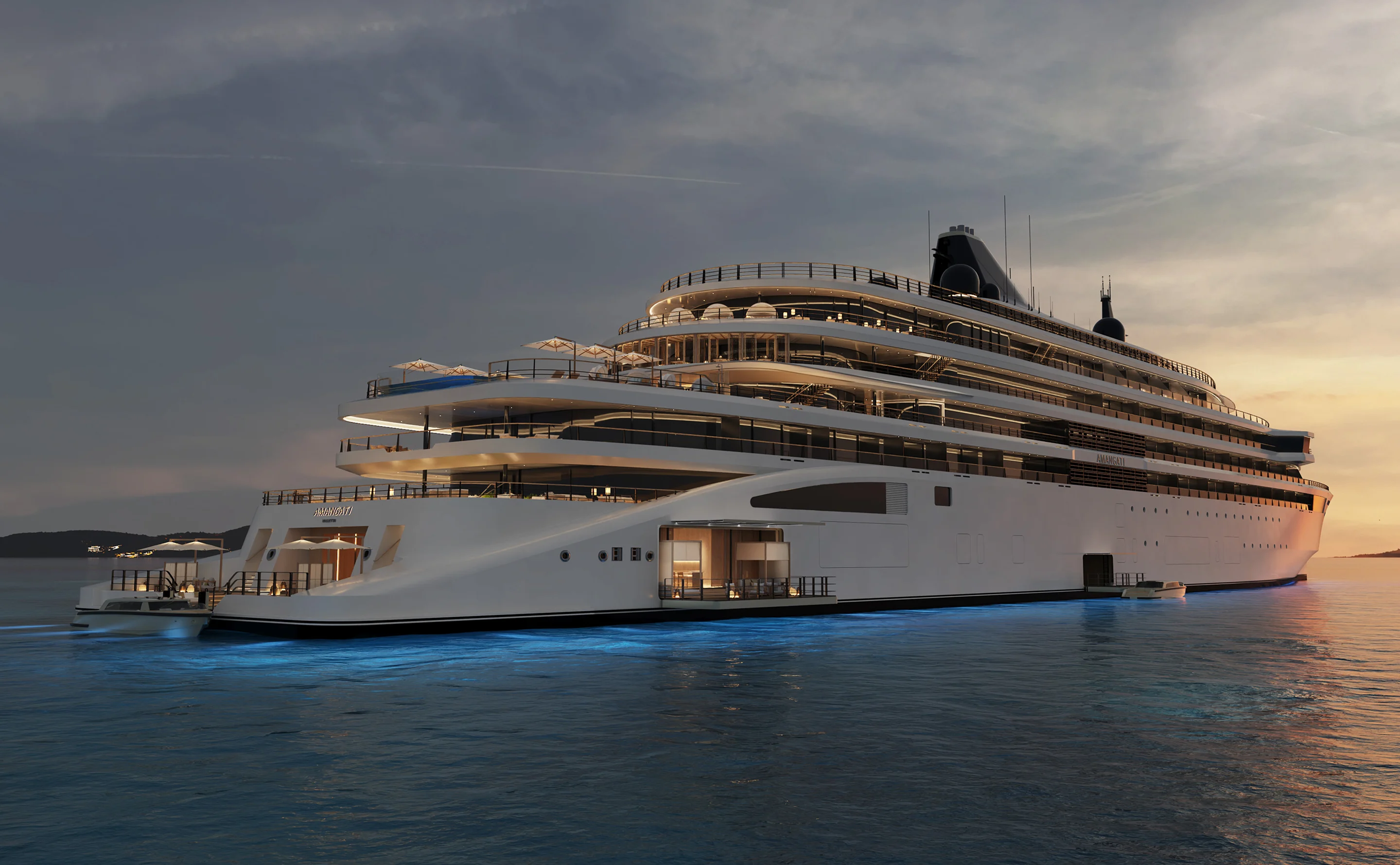 Amangati luxury motor yacht illuminated at sea in the evening
