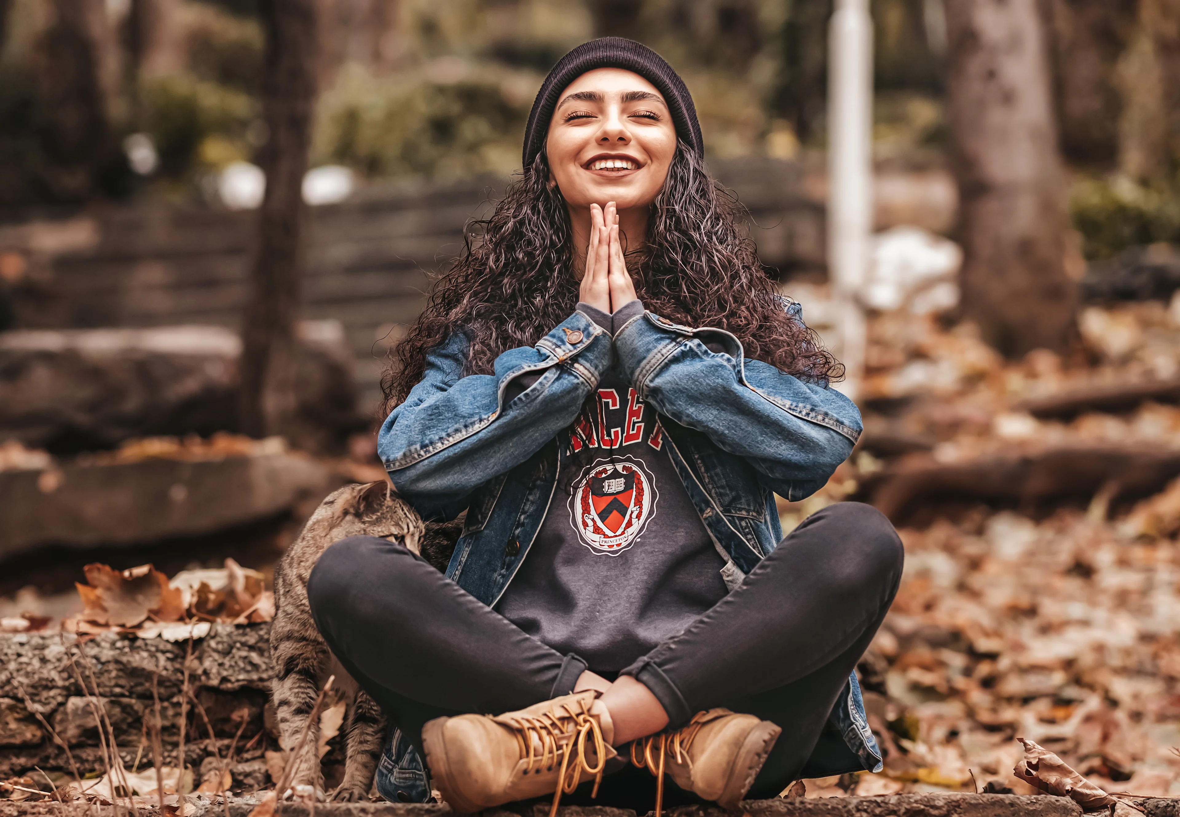 woman sitting in the woods meditating meditation for beginners