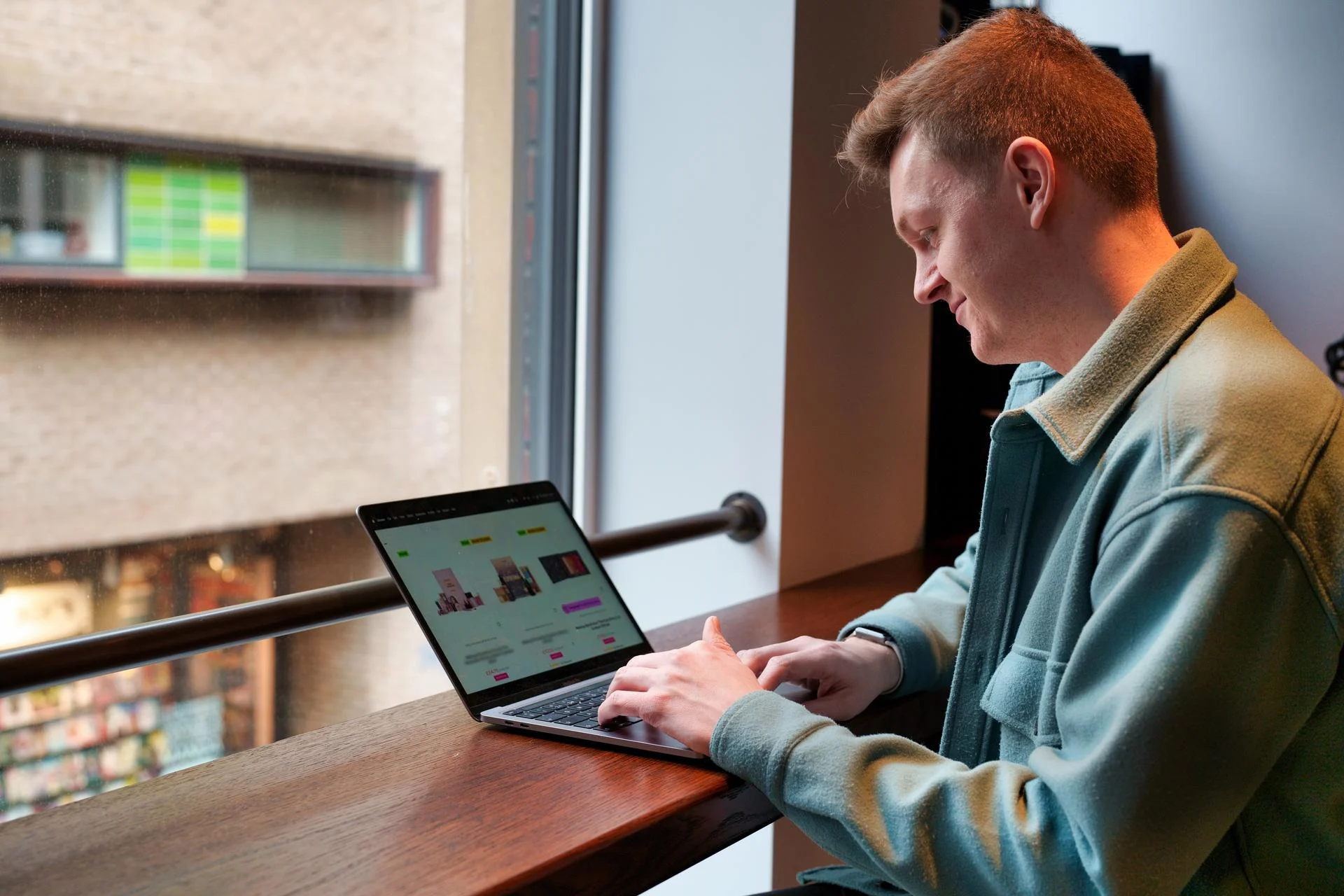 a man looking at a laptop investment big money moments