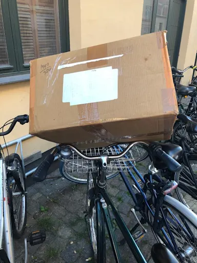 A cardboard box on a bike Parcel delivery scams