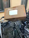 A cardboard box on a bike Parcel delivery scams