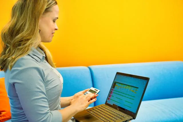 A woman looking at her laptop Is a robo-advisor right for you