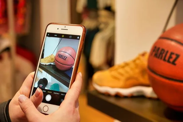 A phone taking a picture of a basketball Regifting