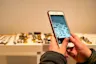 Someone holding a photo and taking a photo of jewelry Product reviews are here