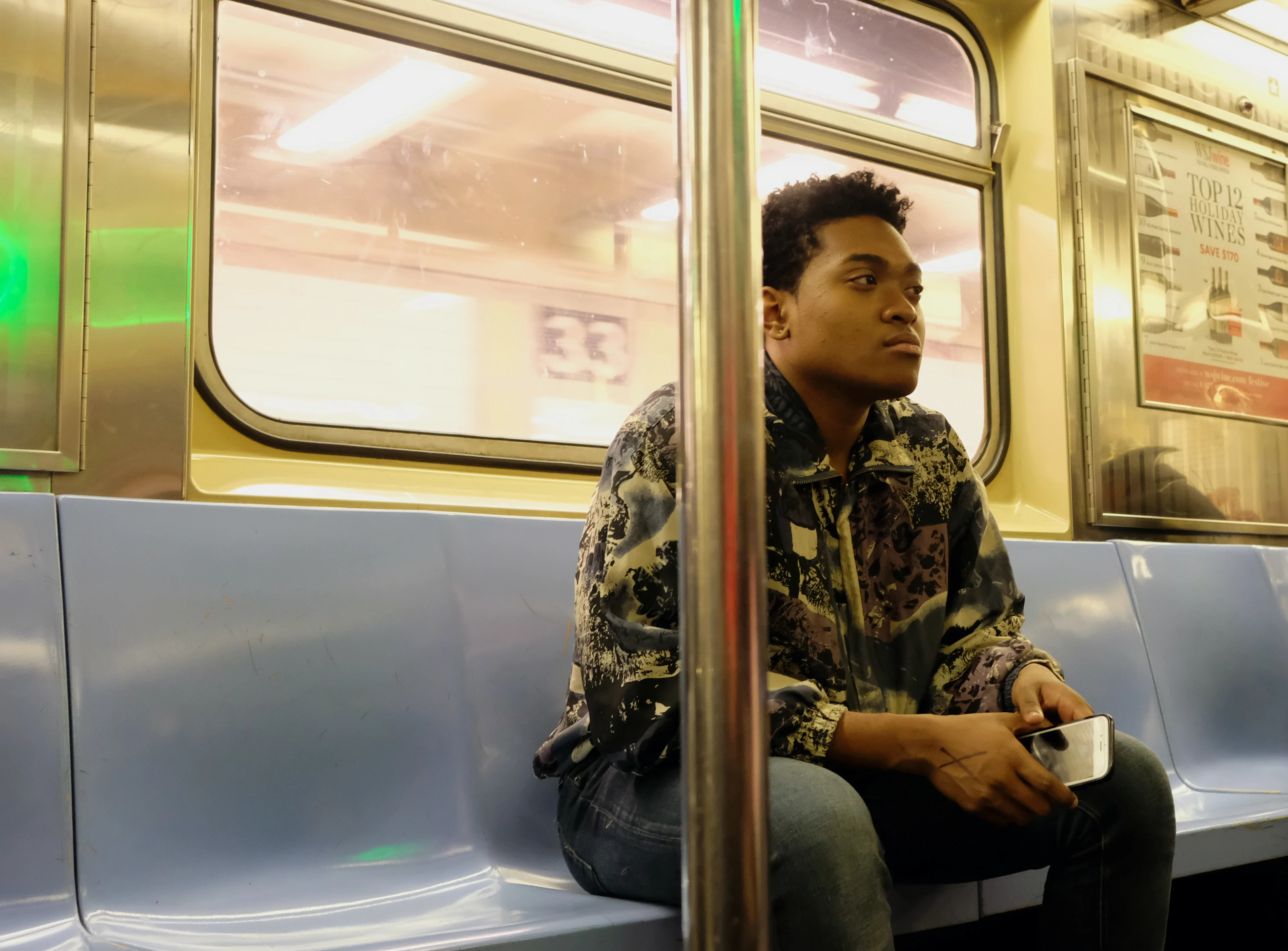 A young man sitting on the subway Finding the right stress and anxiety management tools for you with the help of reviews