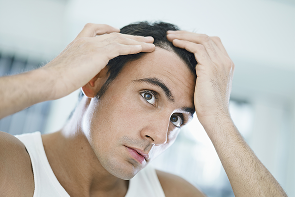 Man parting hair with hands