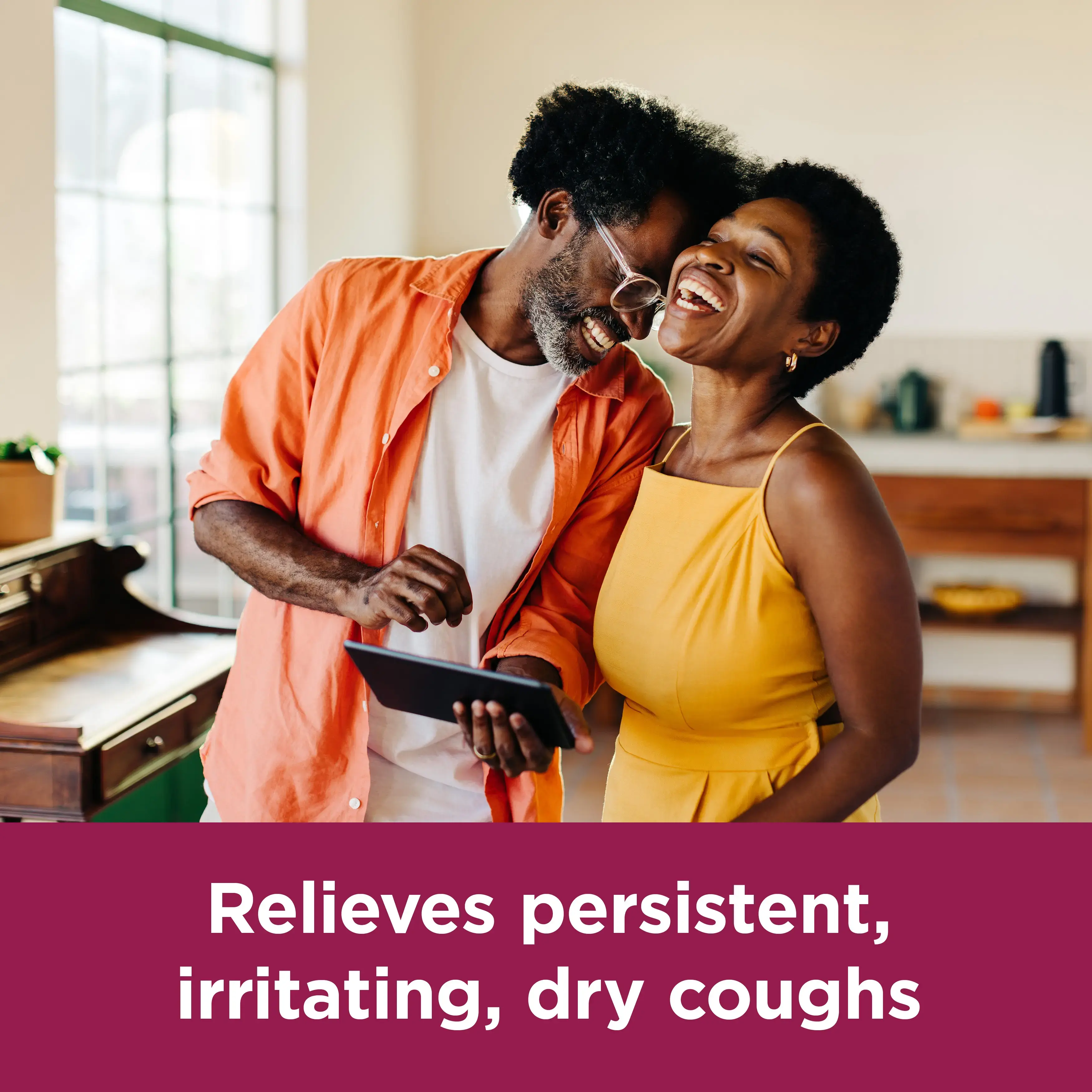 Image showing a couple laughing with the claim: Relieves persistent, irritating, dry coughs