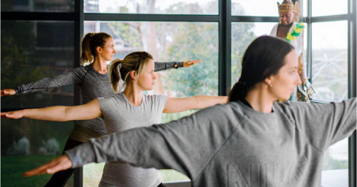 Three people doing yoga exercises