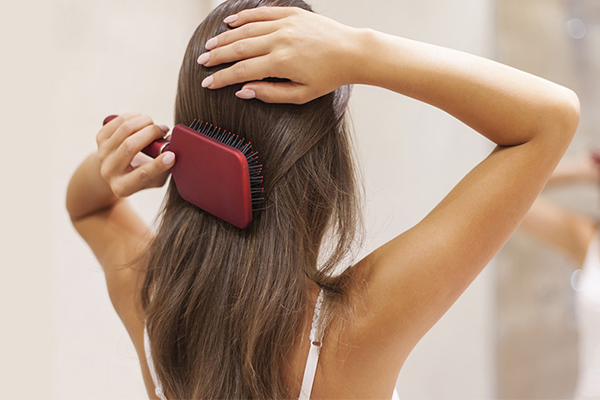 Woman brushing hair