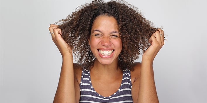 Woman pulling at her hair