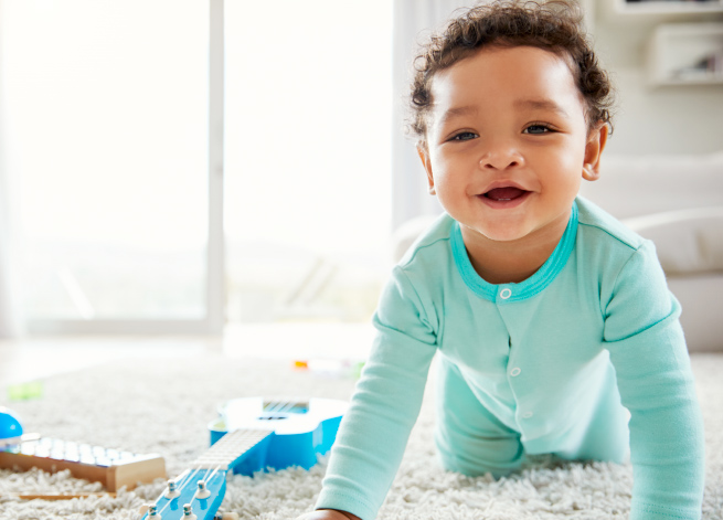 Toddler crawling on carpet