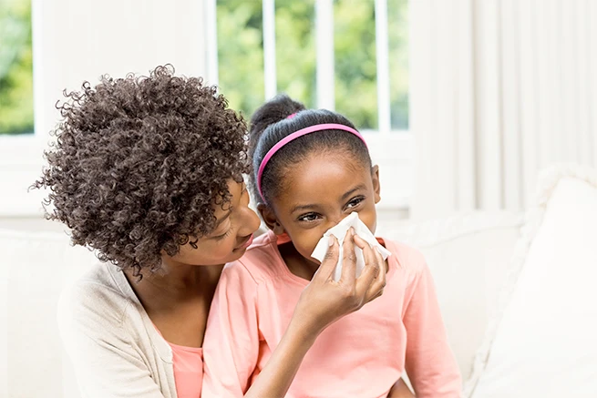 Child blowing their nose