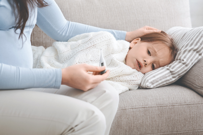 Child in bed with temperature