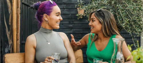 Two women talking together