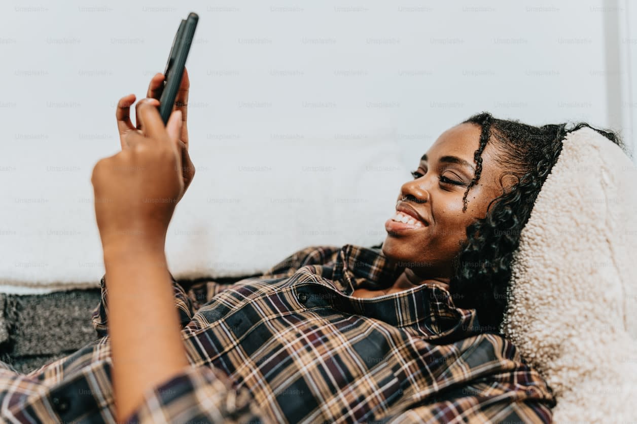 Girl laying down with phone