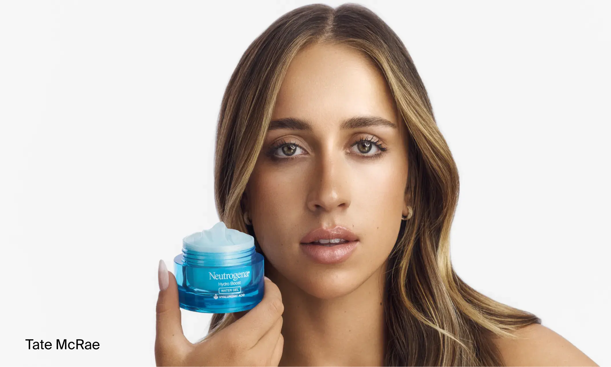 Tate McRae holding an opening jar of Neutrogena Hydro Boost Gel Moisturizer