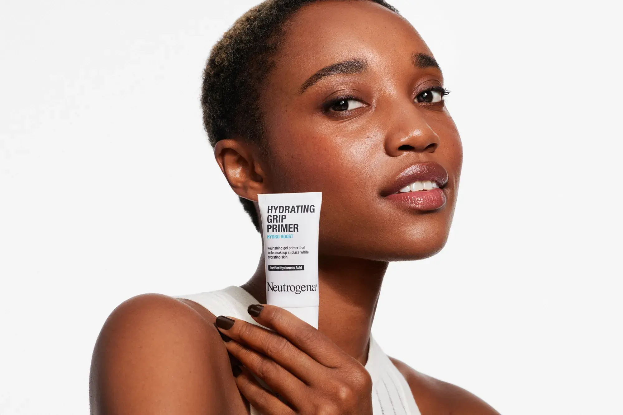 Woman holding Neutrogena® Hydro Boost Hydrating Grip Primer