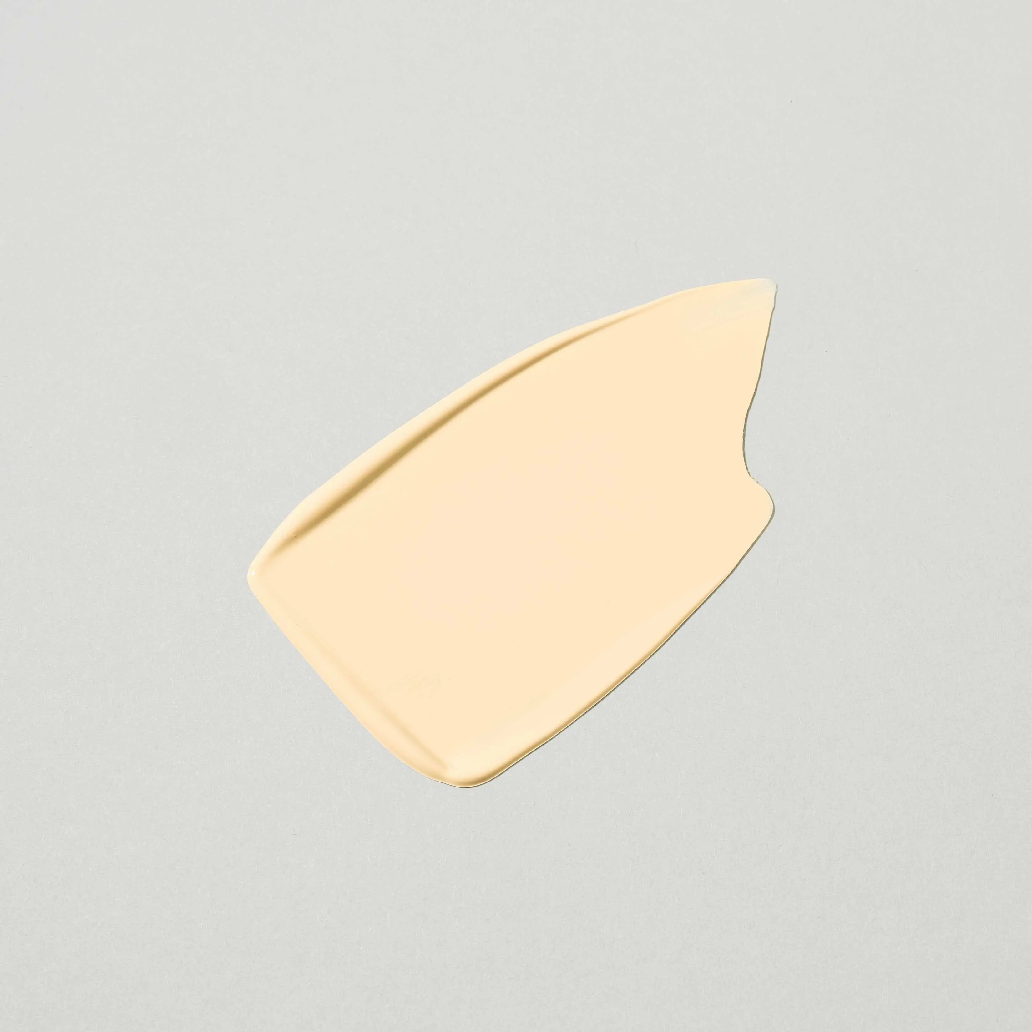 Neutrogena® Clear Coverage Flawless Matte CC Cream smear on a plain grey background.
