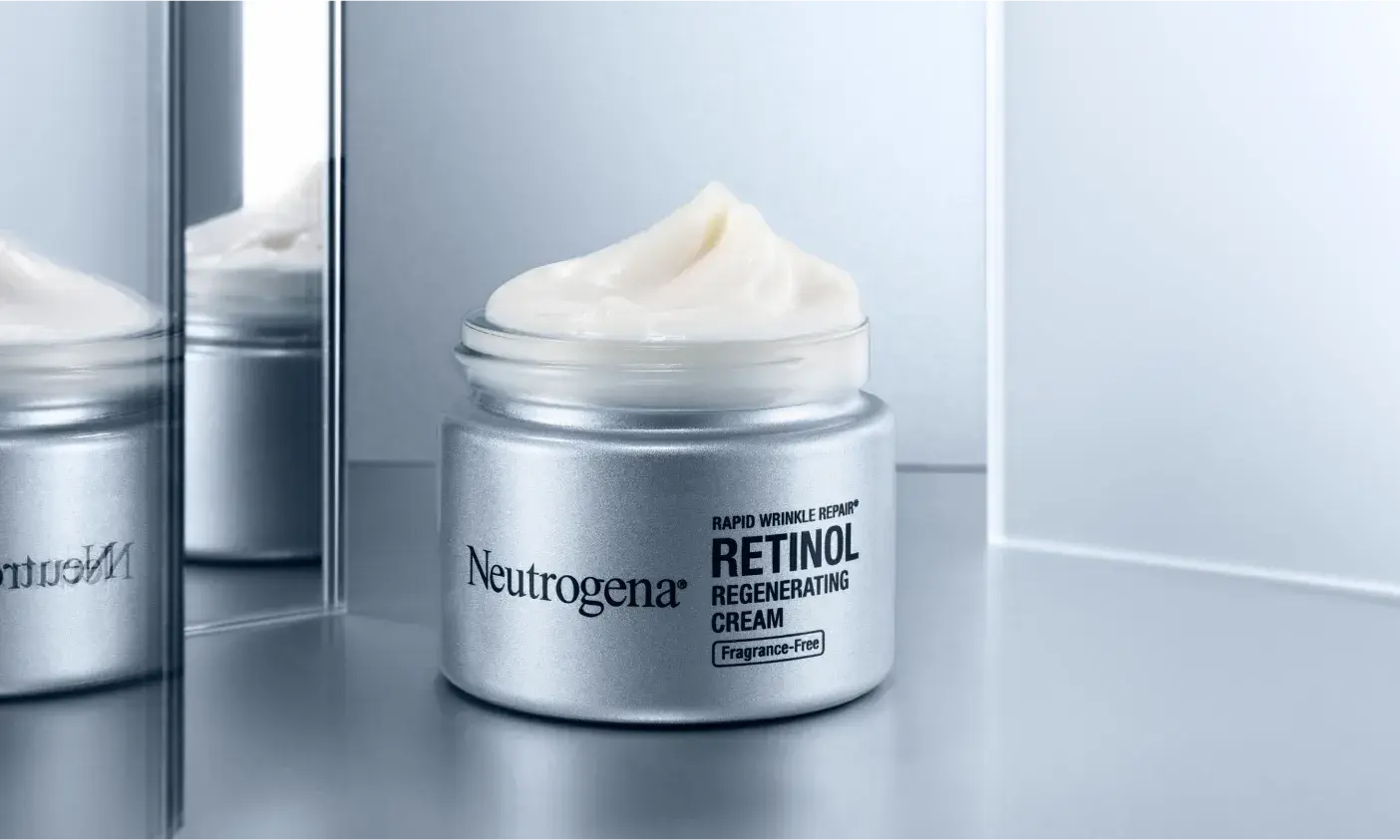 Neutrogena® Rapid Wrinkle Repair® Retinol Regenerating Cream, Fragrance Free Open Jar and Cream texture consistency