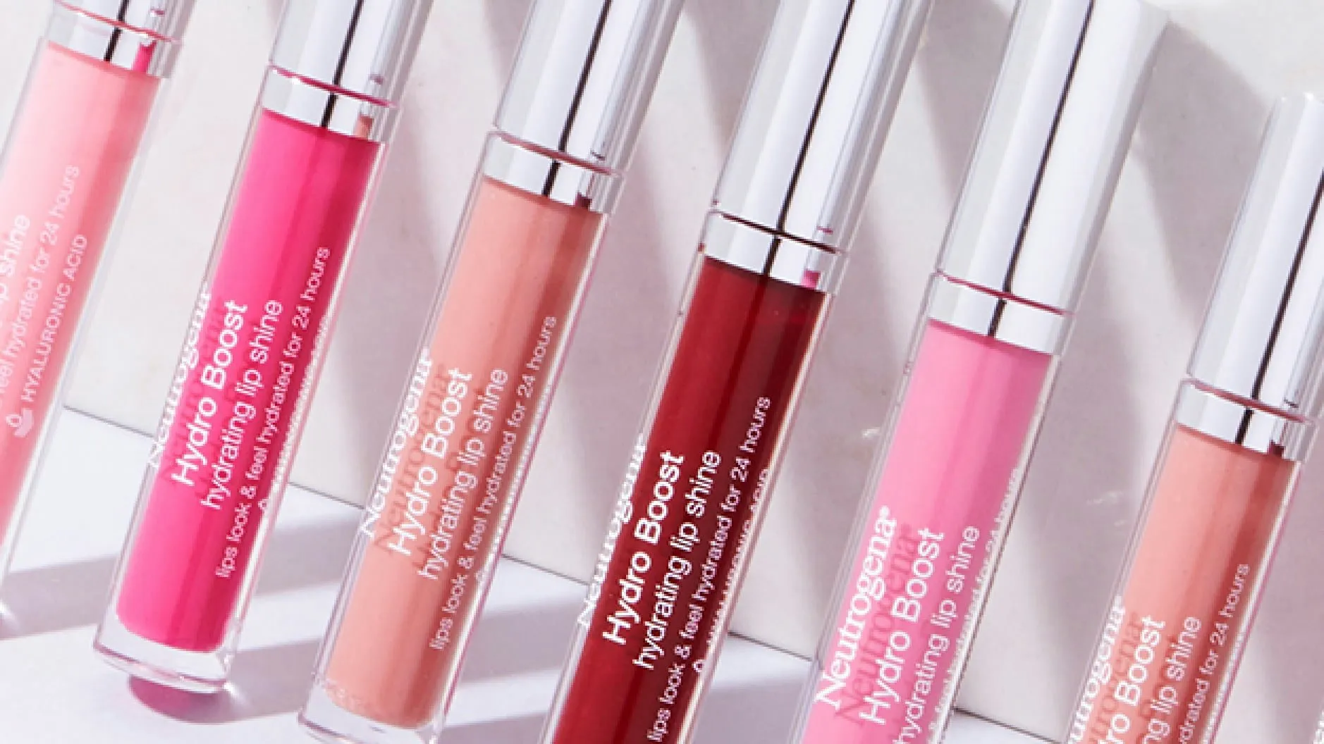 Neutrogena® Hydro Boost Hydrating Lip Shine, step 2, wear alone or layer over lipstick for a boost of shine.