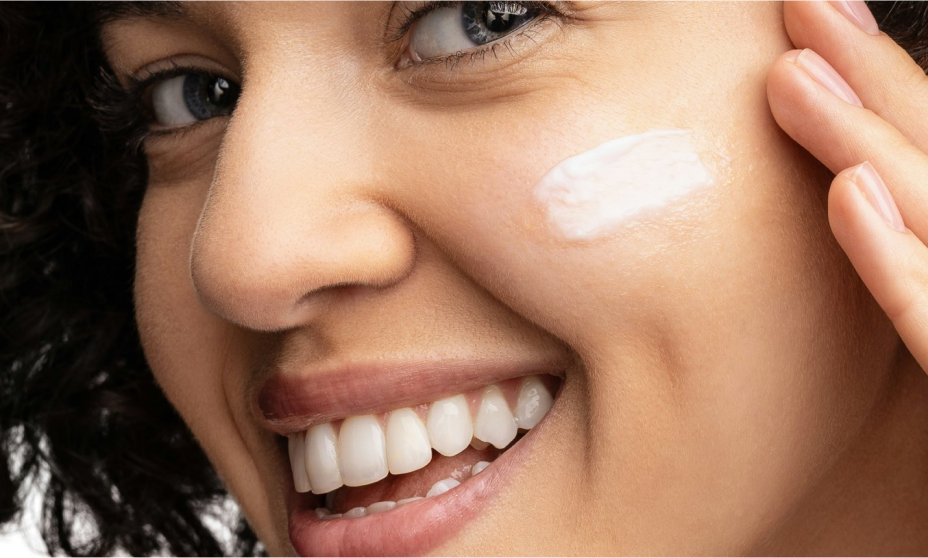Woman using hydro boost water cream with hyaluronic acid to moisturize her face