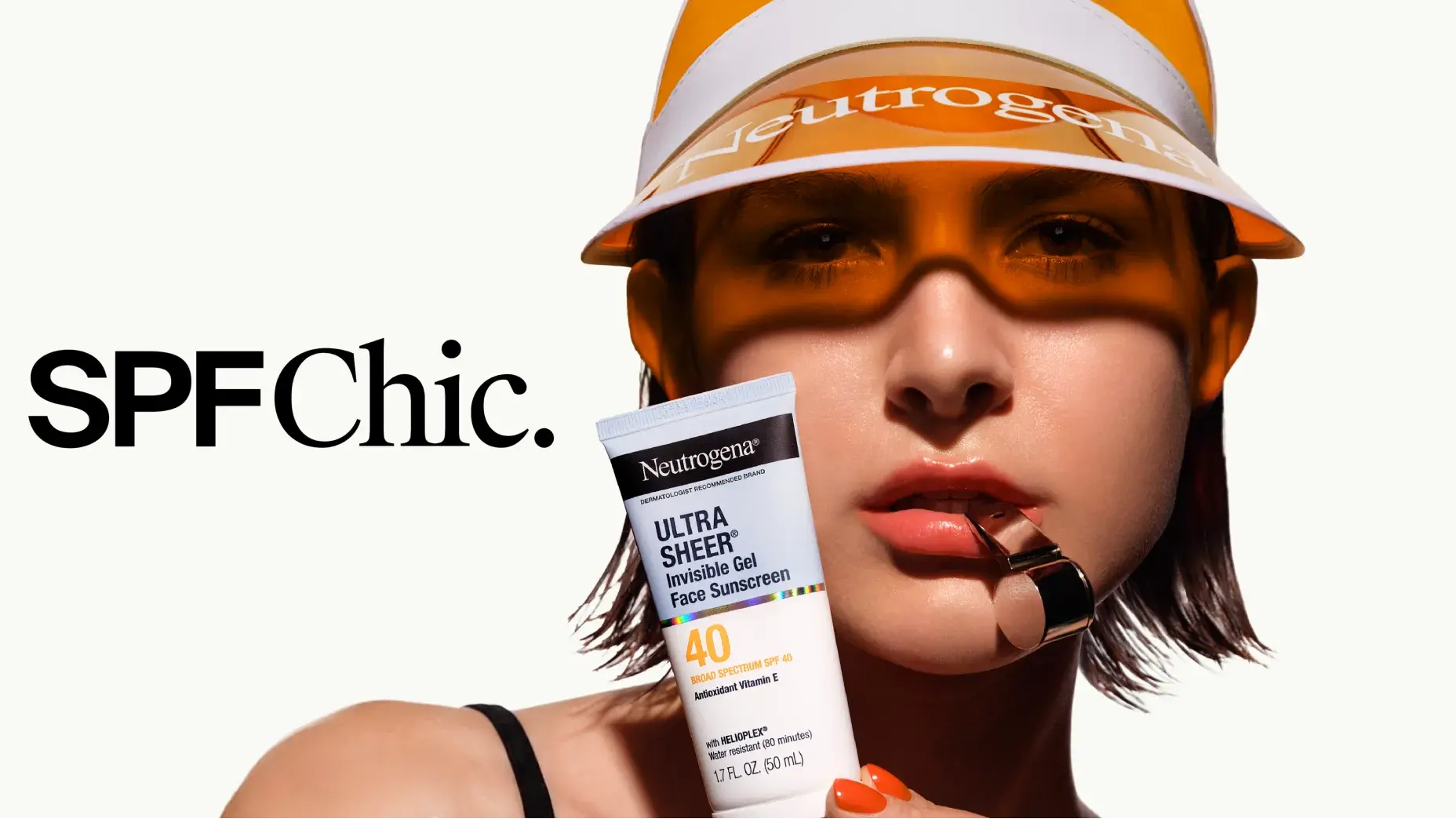 Woman wearing a visor and a tube of Neutrogena® Ultra Sheer Invisible Gel Face Sunscreen Broad Spectrum SPF 40, 1.7 Oz
