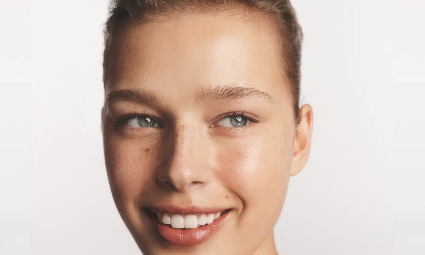 Woman smiling after using Neutrogena® Hydro Boost products