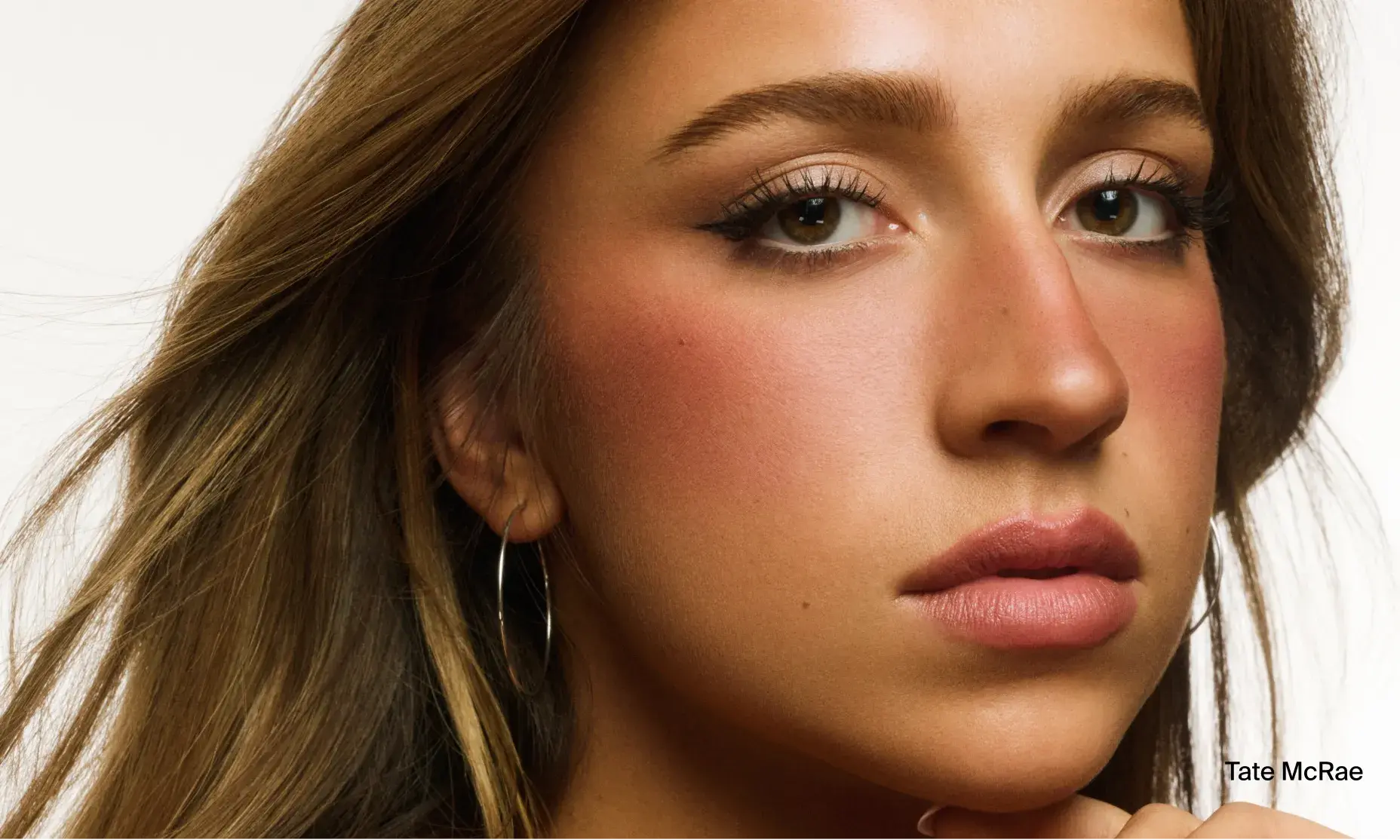 Tate McRae with healthy skin after using Neutrogena® products made with hyaluronic acid for improved skincare