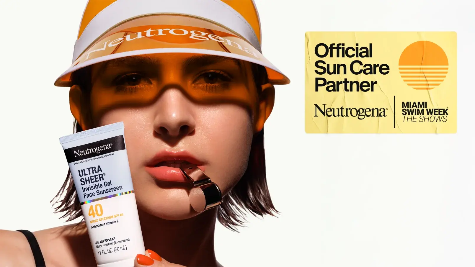 Woman wearing a visor and a tube of Neutrogena® Ultra Sheer Invisible Gel Face Sunscreen SPF 40 for Miami Swim Week