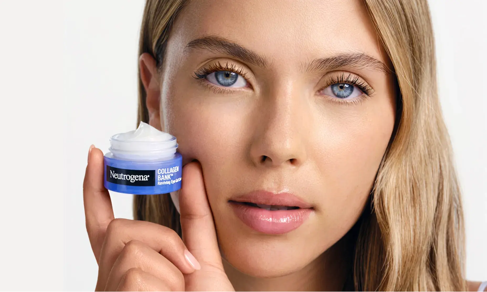 young women holding a small, blue jar of Neutrogena's Collagen Bank Reviving Eye Gel Cream