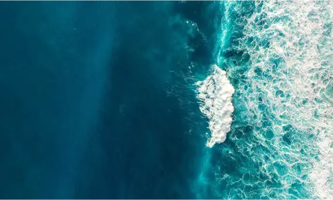 Waves in the ocean crashing against a reef