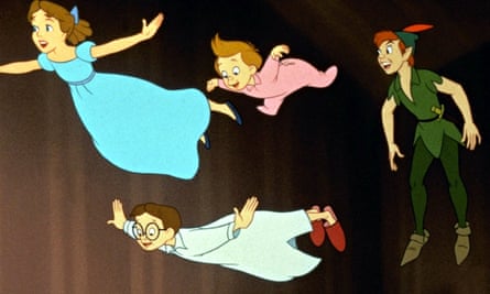 Four white children are flying in the air with their arms out: Wendy, a preteen girl in a blue long nightgown with brown hair and a blue hair bow; Michael, a very young boy in a pink onesie with brown hair; John, a boy older than Michael, wearing a long white nightshirt and red slippers, with brown hair and round glasses; Peter Pan, a preteen boy with red hair, wearing a green shirt, green hat with a red feather, green leggings, and green slippers.