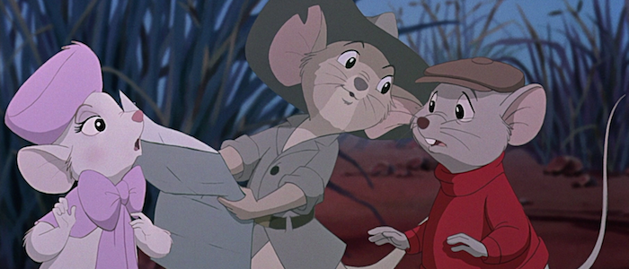 Bianca, a white mouse wearing a pink hat and a pink cape with a bow, looks at Jake, a tan hopping mouse with a notch in his right ear, wearing a brown jacket with a belt and a brown brimmed hat, holding a map. Bernard, a gray mouse with a red turtleneck and brown newsboy cap, also looks at the map.  Behind them is tall grass and brownish-red dirt.