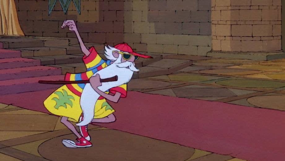 Merlin, an old white man with a very long white beard, wearing a rainbow shirt, bermuda shorts with palm trees on them, a red baseball cap, and red athletic shoes in Chuck Taylor style, appears to be dancing a jig while holding a staff in his hand.  He's in a grand room of a castle with a red carpet on the floor.