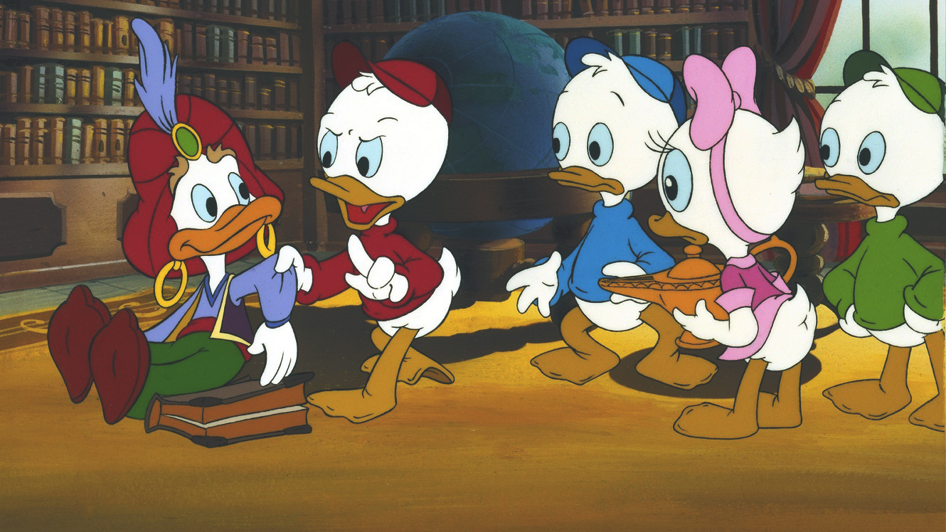 Genie, a white duck wearing a red turban with a blue feather, blue shirt, black vest, gold earrings, green pants, and brown slippers sits on the floor.  Holding his sleeve is Huey, a white duck in a red cap and red shirt, speaking and looking angry at Genie.  Behind them is Dewey, a white duck in a blue shirt and blue hat, Webby Vanderquack, a white duck with a pink dress and pink hair bow (holding a golden lamp), and Louie, a white duck in a green shirt and green hat.  They are in an in-home library with shelves of books and a large globe.