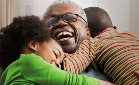 Grandparent hugging kids