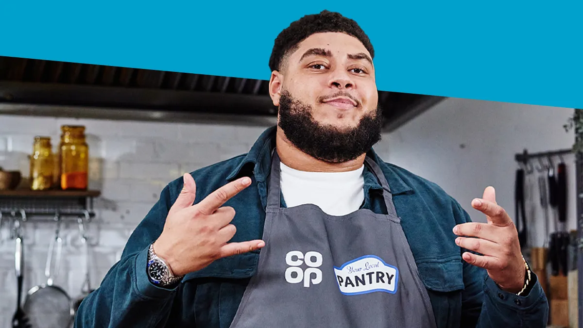 Big Zuu wearing an apron