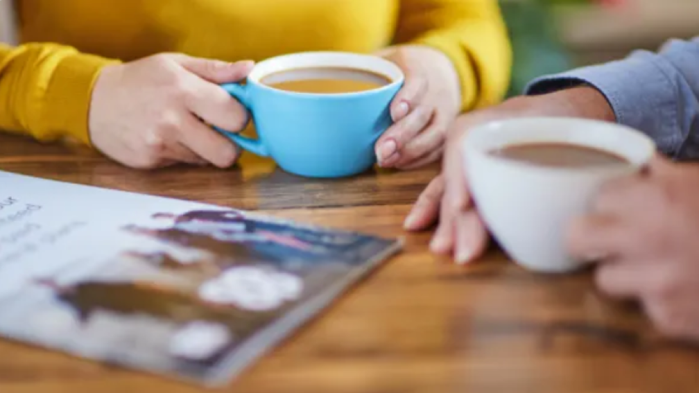 Two people coffee together