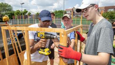 Co-op Foundation volunteers work on construction at a local park