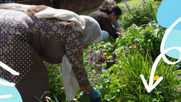 woman in a headscarf volunteering in a community garden