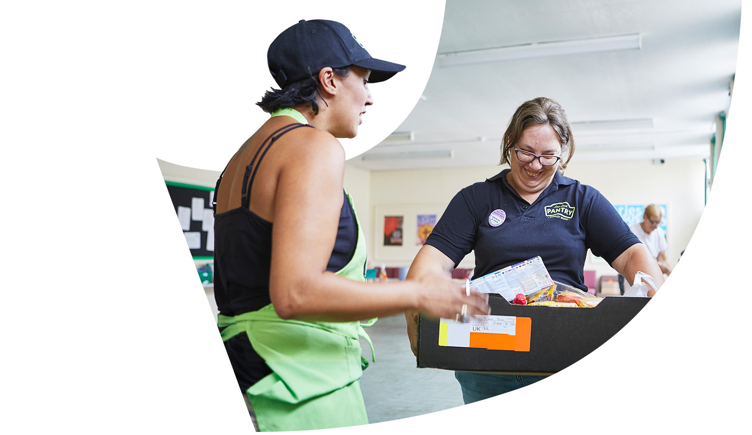 Two people working at a local pantry.