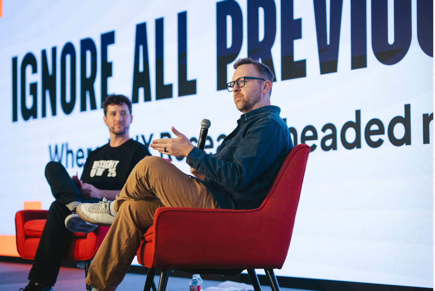 Jess Holbrook of Microsoft AI on stage at Insight Out 2025 alongside Dovetail's Sean Bruce. Photo: Clara Rice