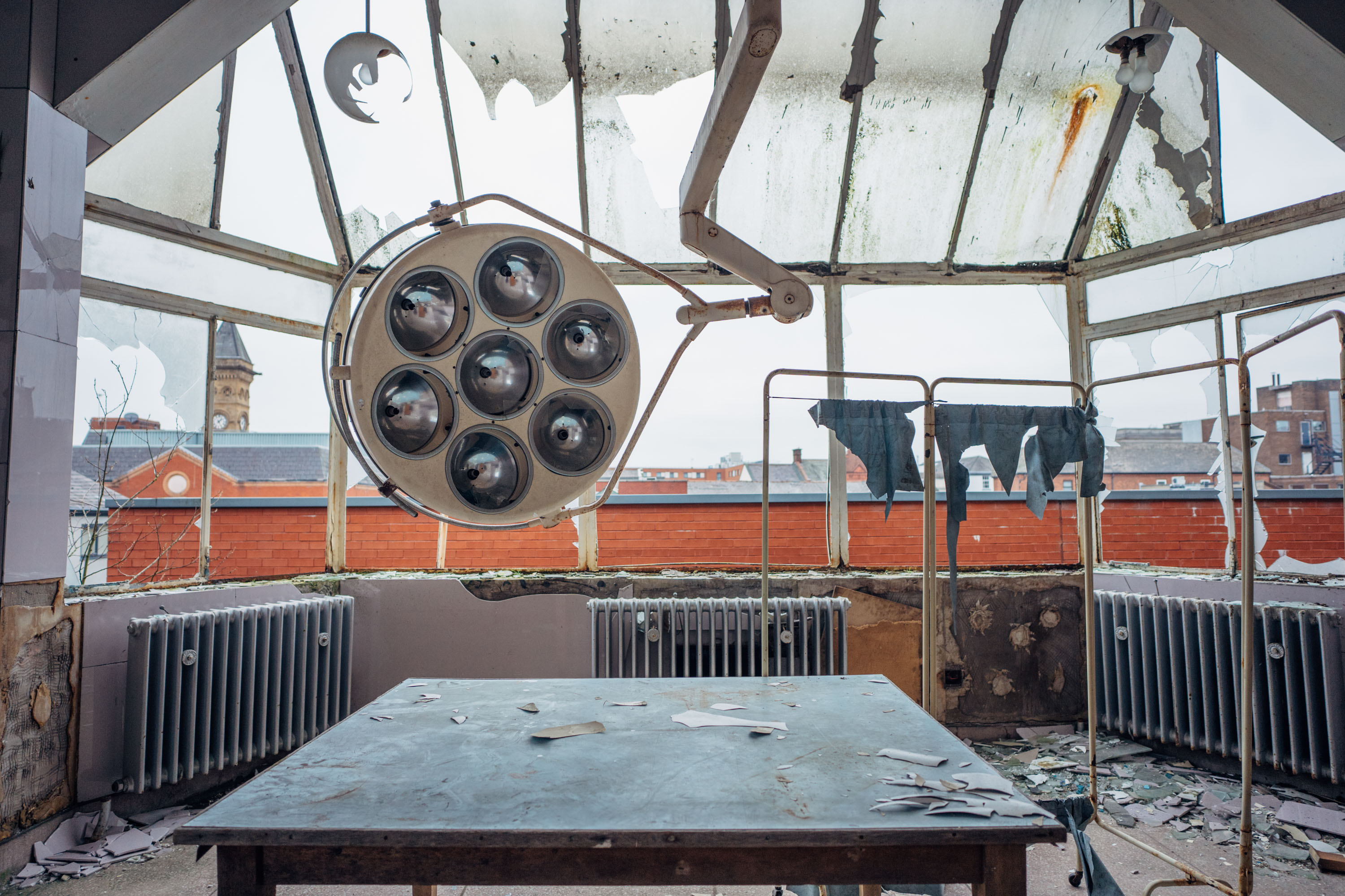 An old dentists light in a derelict room