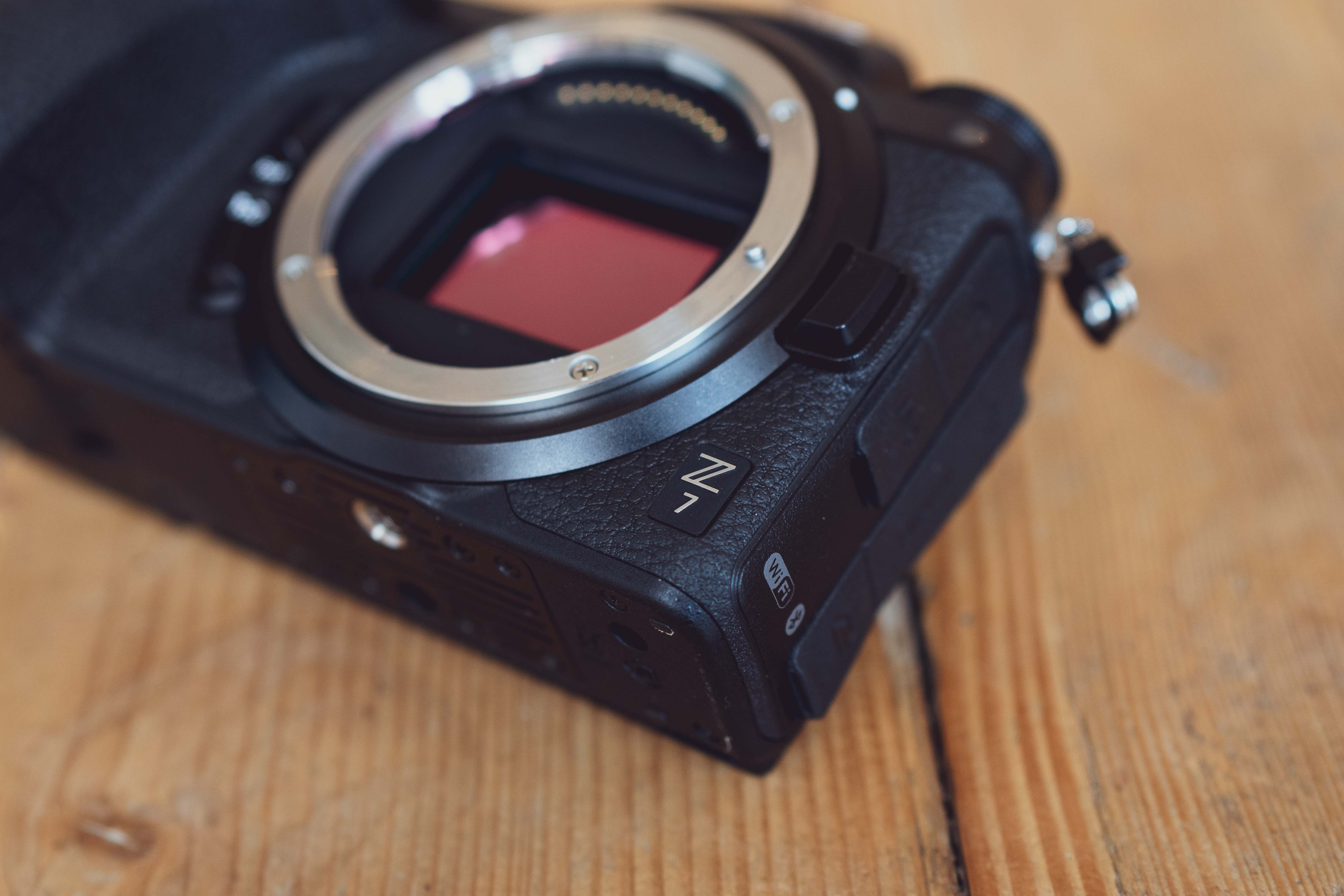 A close up shot of a Nikon Z7, with light reflecting against sensor