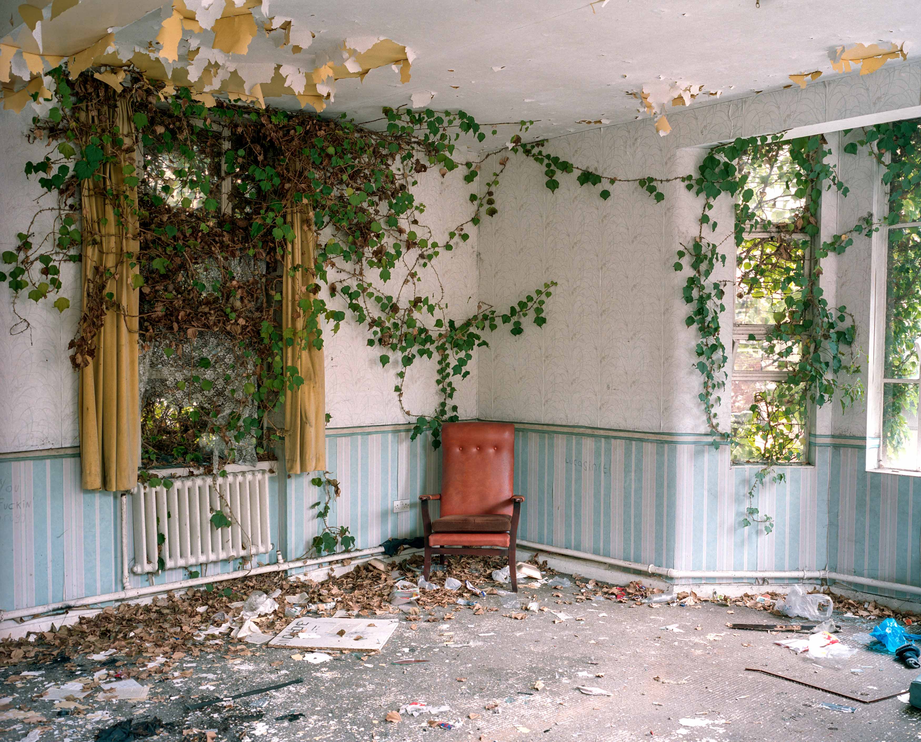 A red chair in an empty room