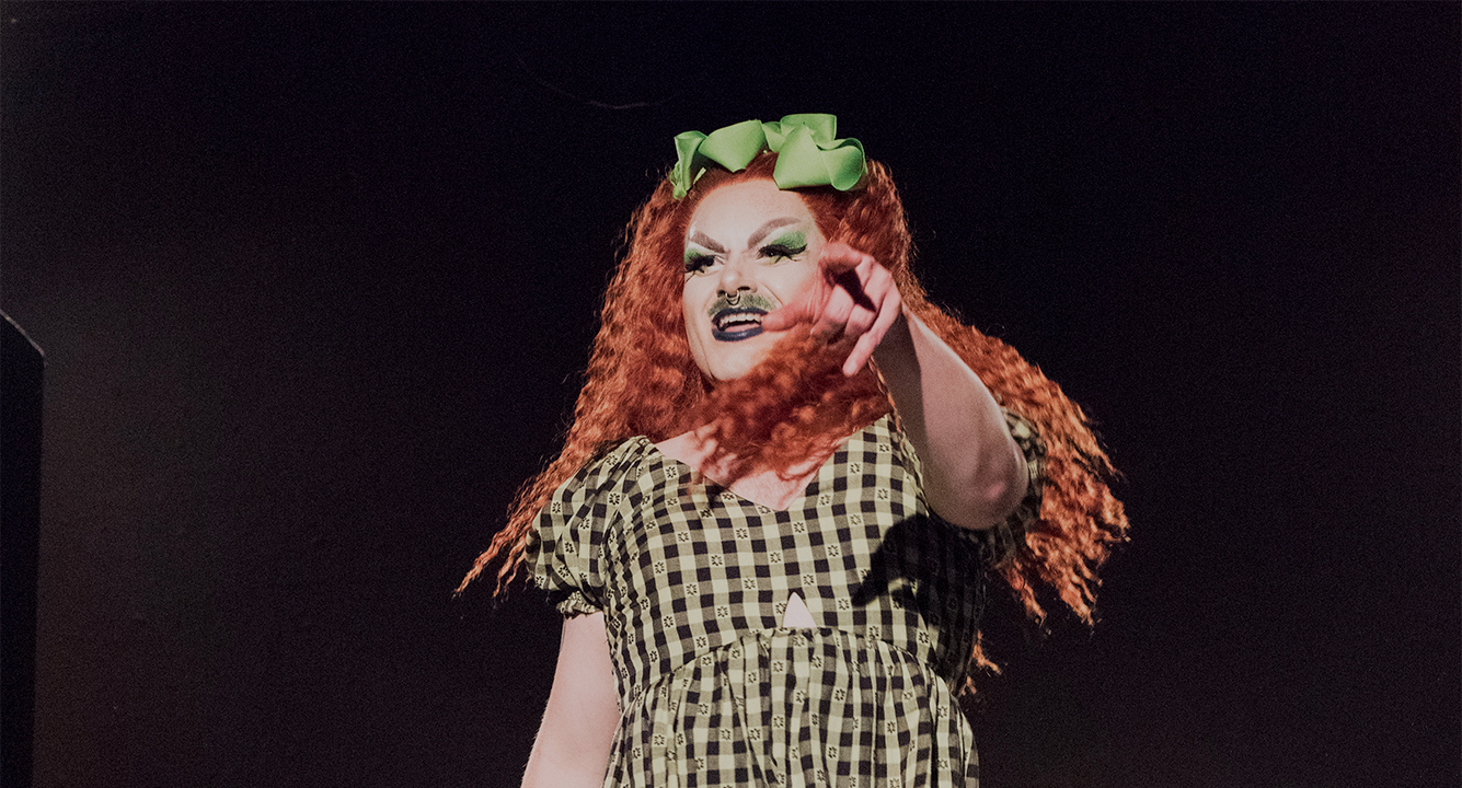 Drag queen Dick Day performing on stage