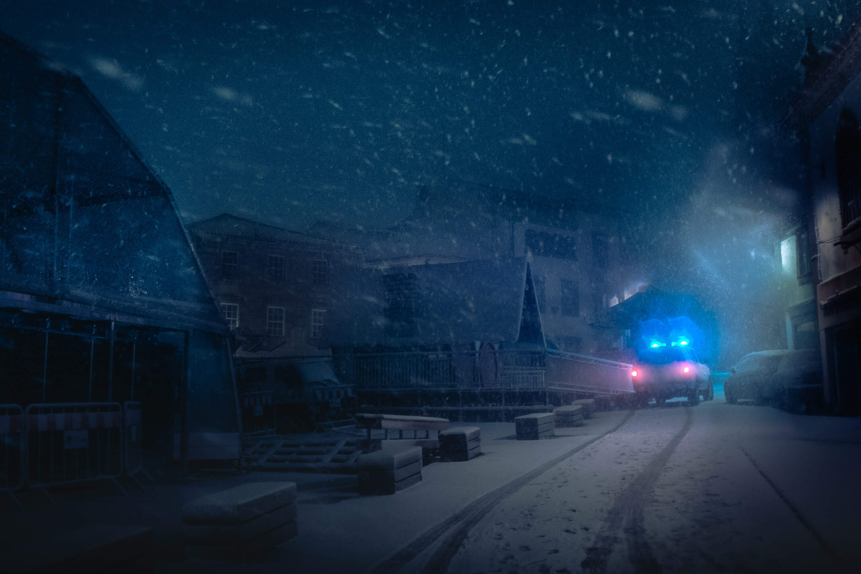 an ambulance in a snow storm at night